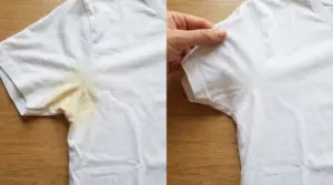 Maglietta bianca con macchia di sudore prima e dopo la pulizia